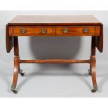 An early 19th century mahogany sofa table,