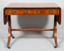 An early 19th century mahogany sofa table,