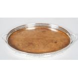 A silver plated and wooden pierced oval gallery tray, 20th century, with loop handles,