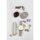 A collection of jewellery to include: Three brooches; A curb bracelet; A scottie dog ornament;