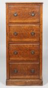 A Victorian dark-stained oak tall four drawer chest,