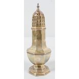 A silver octagonal baluster sugar caster, with pierced pull off top with an urn finial,