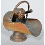 A late 19th century copper coal scuttle, with shovel,