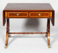 A Regency mahogany sofa table, early 19th century with satinwood cross banding,