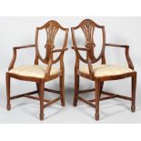 A pair of George III style mahogany carver dining chairs,