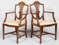 A pair of George III style mahogany carver dining chairs,