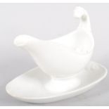 A Continental porcelain white sauce boat and stand, with lion terminal,