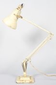 A mid 20th century Herbert Terry & Son anglepoise lamp, cream coloured, on stepped square base,