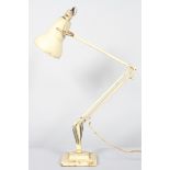 A mid 20th century Herbert Terry & Son anglepoise lamp, cream coloured, on stepped square base,