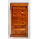 A Victorian mahogany Wellington chest, mid 19th century, with carved acanthus side panels,