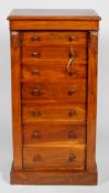 A Victorian mahogany Wellington chest, mid 19th century, with carved acanthus side panels,