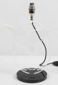 A modernist perspex table lamp, modelled as an outstretched dove, on black circular base,