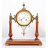 A barrel shaped oak cased mantel clock with brass mounts, white enamel dial,