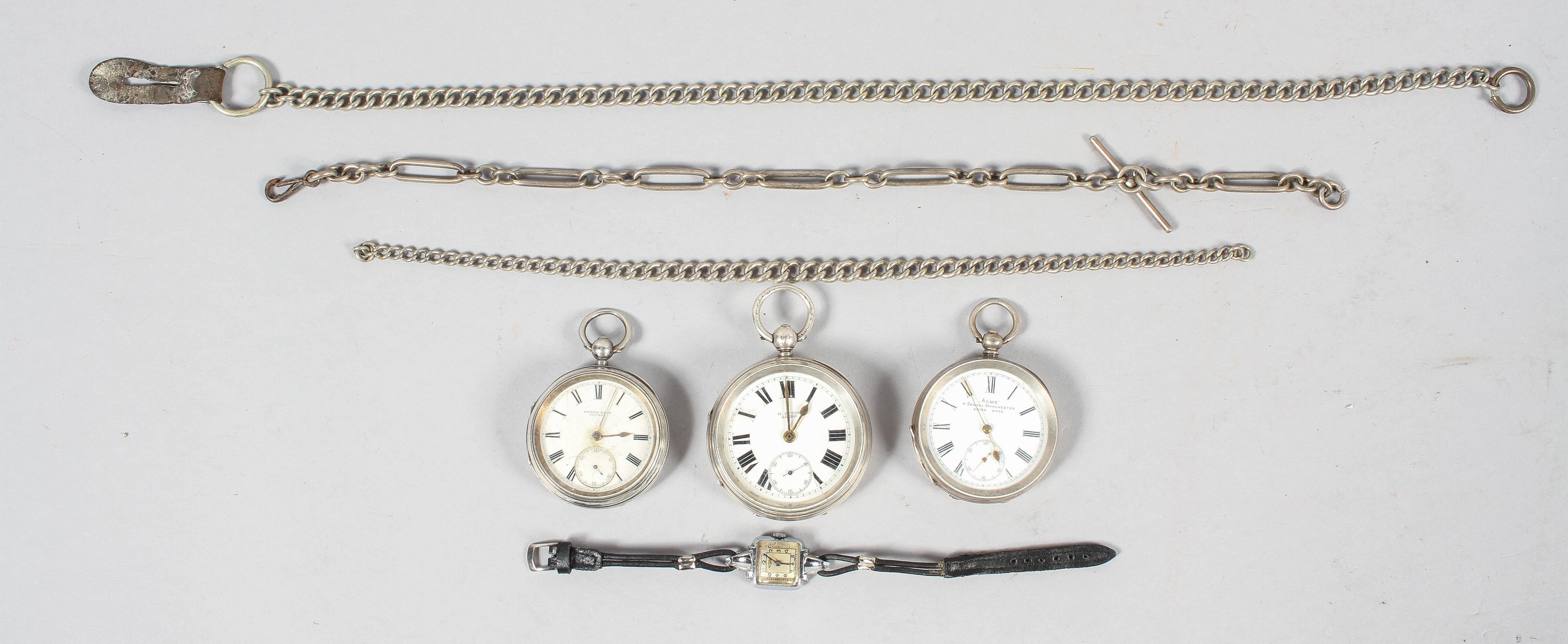 A collection of three open face pocket watches.