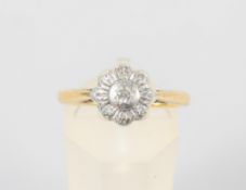 A yellow and white metal illusion set single stone diamond ring. No hallmark - stamped 18ct Plat.