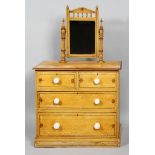 A painted pine chest of drawers, two small over two large drawers,