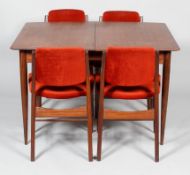 A 1960's teak dining table and four dining chairs, the extending table with two additional leaves,