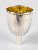 A small silver spirit funnel of tall bowl form, with gilt interior, by Asprey and Company,