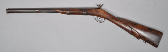 An Indian Percussion Carbine rifle with carved detail to stock