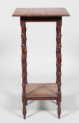 A Victorian mahogany two-tier stand with turned baluster supports and feet,