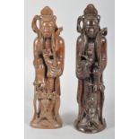 Two Chinese root carvings of Buddhist figures, each carrying a ball and with other attributes,