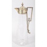 A silver plated engraved glass claret jug, circa 1890, the mounts engraved with laurel motifs,
