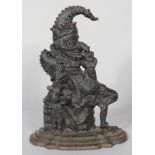 A Victorian cast iron door stop, modelled as Punch the jester and jester dog,