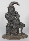 A Victorian cast iron door stop, modelled as Punch the jester and jester dog,