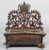 A Gloucestershire Regiment carved wood fretwork stand inkwell,