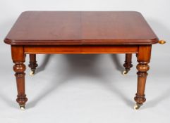 A Victorian mahogany D-section extendable dining room table with two additional leaves,