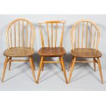 Three Ercol pale beech and elm stick back kitchen chairs,
