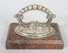 An Edwardian silver plated serpentine mounted paperweight,