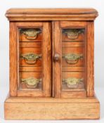 A Mahogany and oak table top collector's cabinet, circa 1880,