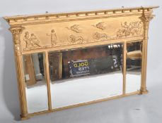 A Regency 19th century gilt and gesso moulded triple panel over mantle mirror having scenes of