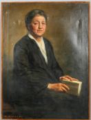 Giorgio Matteo Aicardi (1891-1984), Portrait of a Lady wearing black, holding a book, oil on canvas,