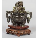 A Chinese carved mottled jade censer with cover and hardwood stand, 20th century, of mottled grey,