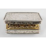 A silver vinaigrette, engraved with scrolling foliates with gilt interior,
