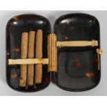 An Edwardian tortoiseshell cigarette case, of rounded rectangular form,