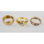 A collection of three rings to include: A single stone zircon ring;