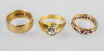 A collection of three rings to include: A single stone zircon ring;