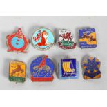 A collection of eight vintage Butlin's badges, each enamelled on a metal brooch,