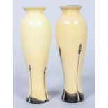 A pair of Caithness cased baluster glass vases,