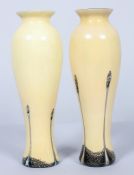 A pair of Caithness cased baluster glass vases,