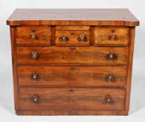A Victorian mid 19th century chest of drawers with three short drawers above three long drawers,