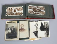 A collection of vintage postcards and an album,
