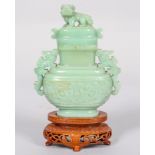 A Chinese carved jade censer, cover and hardwood stand,