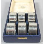 A boxed set of six silver numbered napkin rings by James Dixon and Sons, Sheffield 1917,