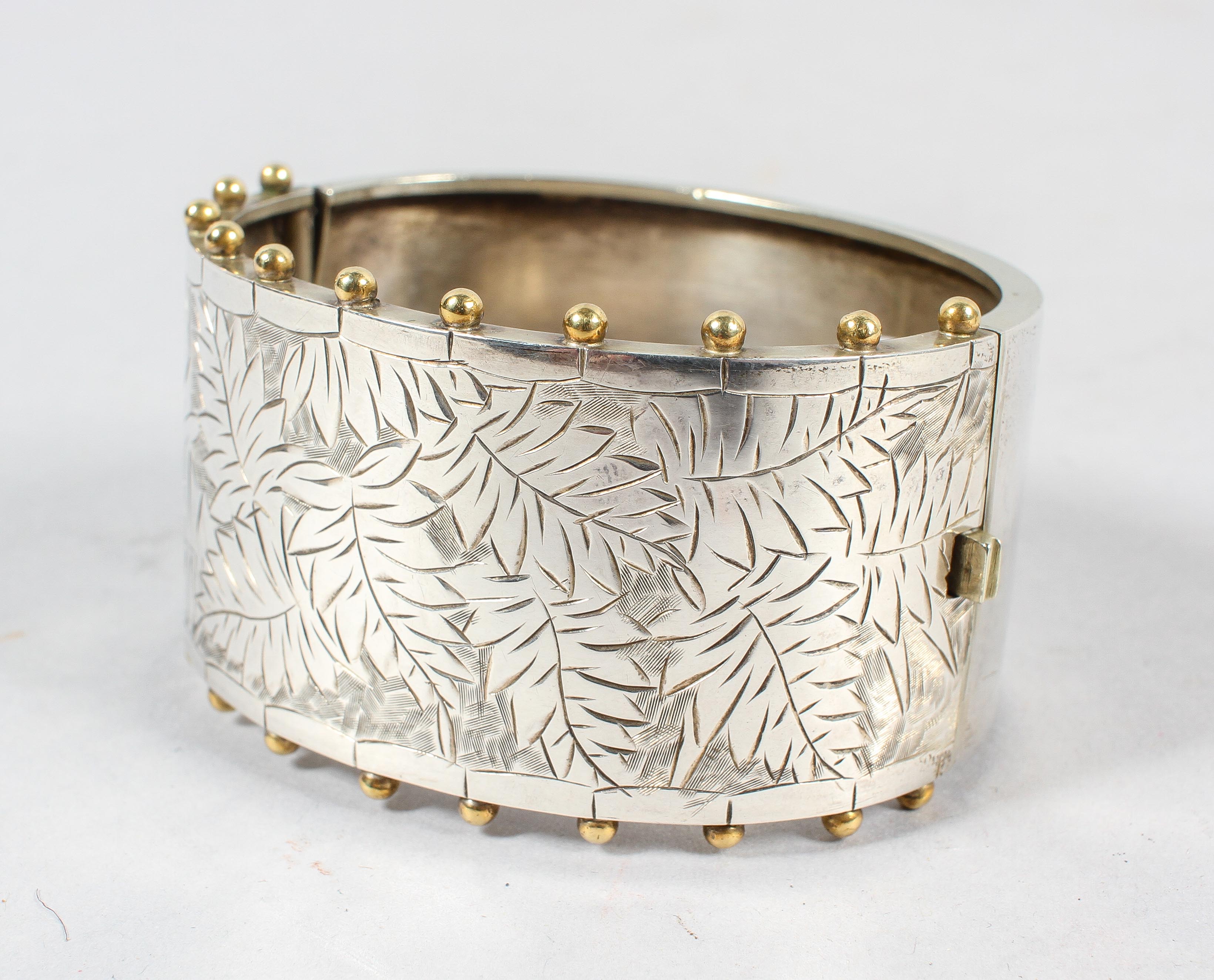 A 19th century aesthetic movement hinged silver bangle,