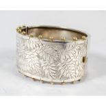 A 19th century aesthetic movement hinged silver bangle,