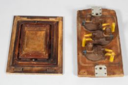 Two individual wooden carved block moulds, the first painted in yellow,